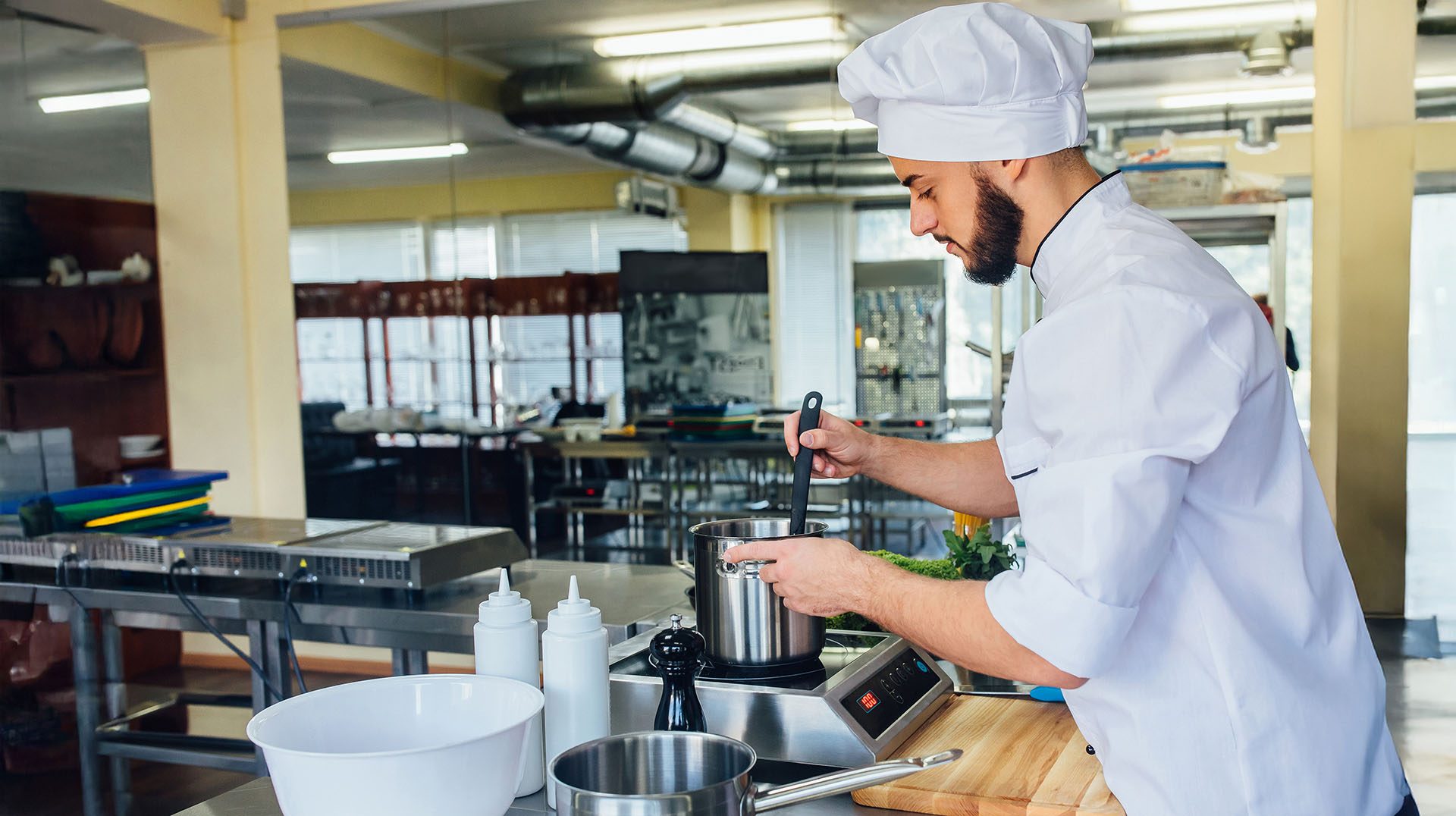 Chef plating in a professional kitchen