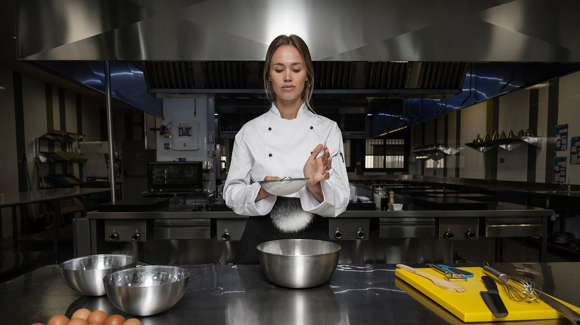 Chef cooking with pots on the range
